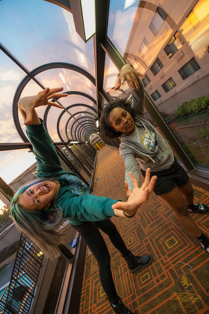 Cynthia Kim (left) and Angel Telfair (right) ham it up for the camera in a hotel on the first night of the trip in Oregon.