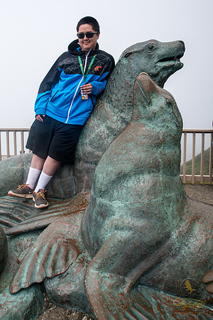Melvin Kagak posing with some sea lion friends at Sea Lion Caves in Oregon.