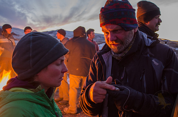 Field Camp Director, Dr. Jochen Mezger, answers questions about a rock belonging to biology student Fleur Nicklen.