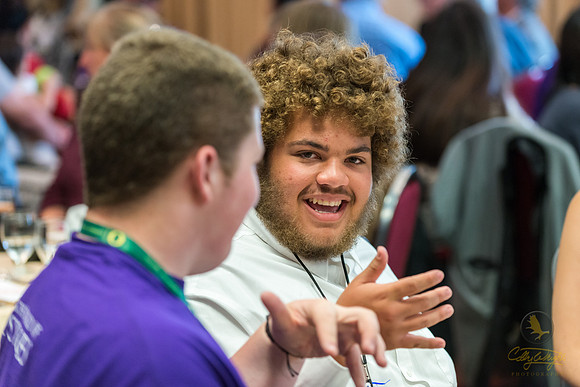 Elijah Williams (facing) talks with Weston Reeves at the GeoFORCE Alaska closing ceremony in Anchorage, Alaska