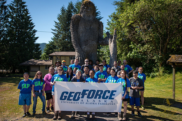 This is Sasquatch Country: GeoFORCE students pose in front of a towering statue of the legendary creature.