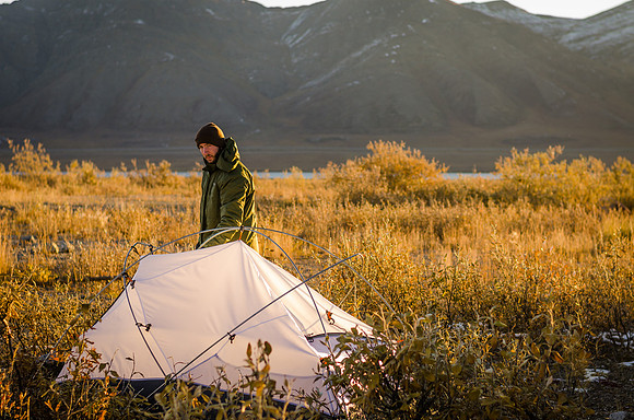 Paul Wilcox, a University of Alaska geology PhD student, takes down his tent before the long drive back to Fairbanks.