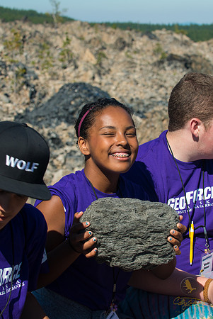 Angel Telfair holds up a chunk of pumice at Newberry Volcano in Oregon.